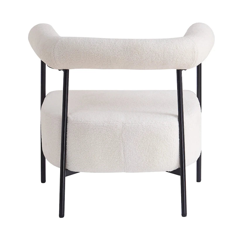 Fauteuil d'appoint moderne en tissu bouclé, avec accoudoirs incurvés et structure en métal noir.