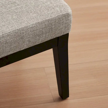 Fauteuil rembourré de style Mid-Century 27,7 avec structure en bois massif et repose-pieds.