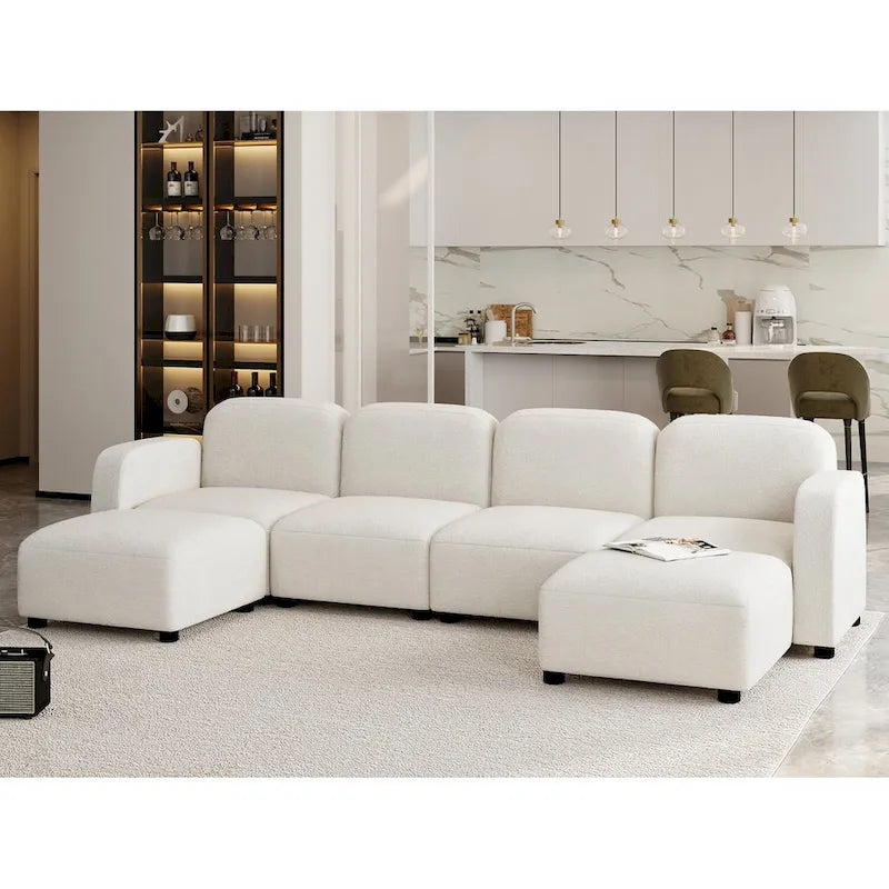Canapé d'angle modulable en velours en forme de U, 6 places, avec deux poufs, design réversible pour un espace de vie personnalisable.