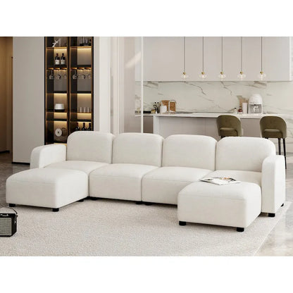 Canapé d'angle modulable en velours en forme de U, 6 places, avec deux poufs, design réversible pour un espace de vie personnalisable.