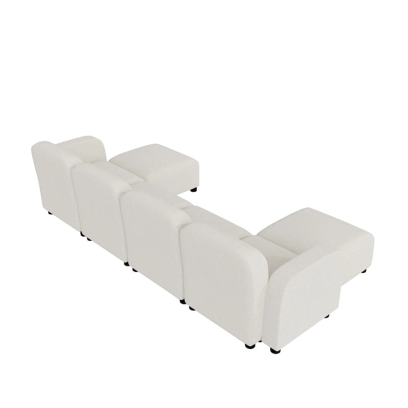 Canapé d'angle modulable en velours en forme de U, 6 places, avec deux poufs, design réversible pour un espace de vie personnalisable.