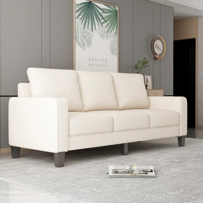 Canapé en tissu beige avec accoudoirs carrés et dossier capitonné