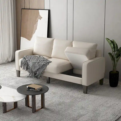 Canapé en tissu beige avec accoudoirs carrés et dossier capitonné